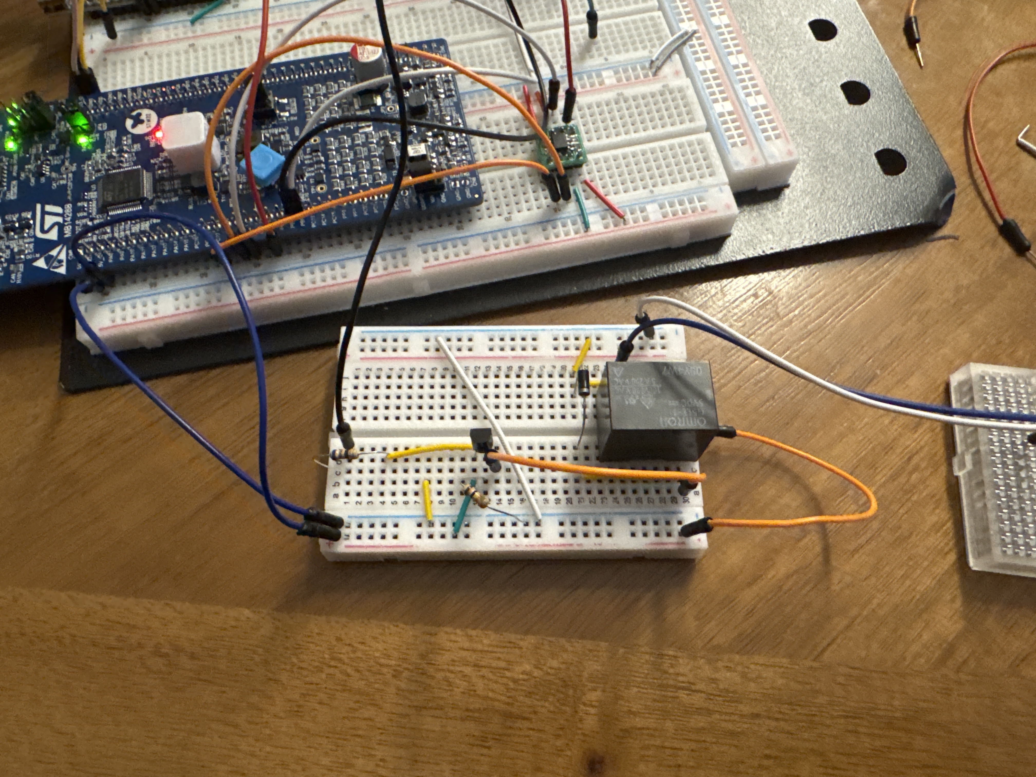 Early minb electronics assembled on breadboards with a development board and wiring